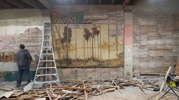 A couple renovating a 115-year-old building discovered two 60-foot-long hidden murals